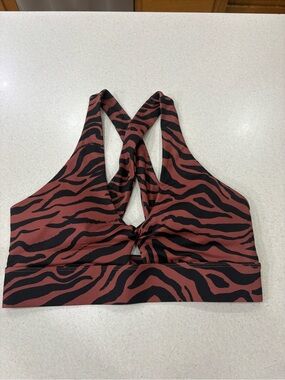Fabletics Women's Zebra-Print Twist Front Sports Bra - Rust/Black